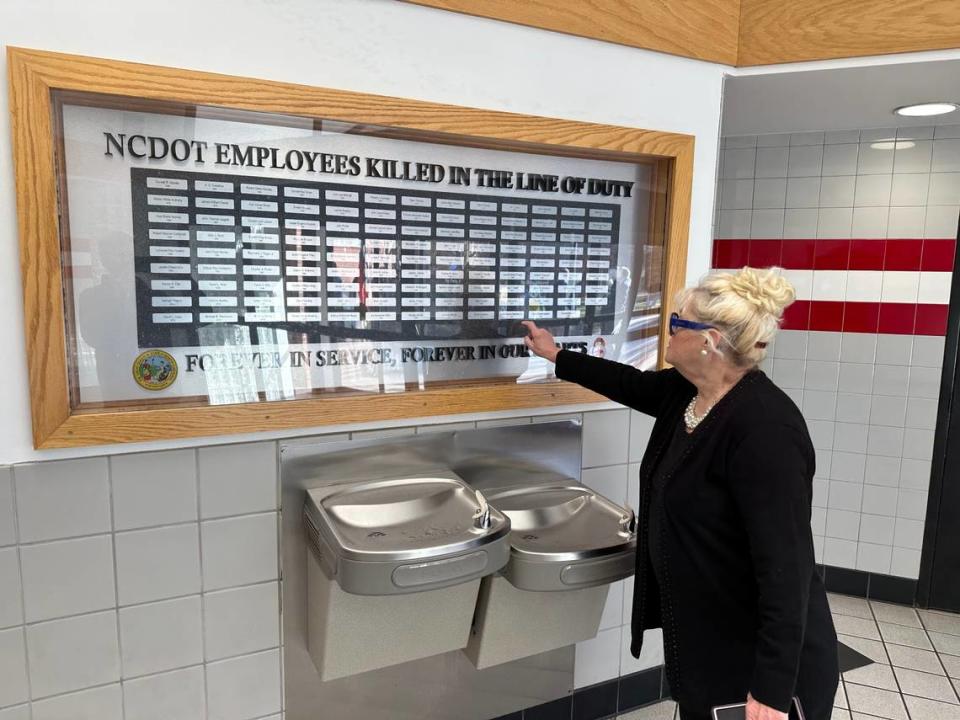 Kathy McGee Sledge points to the name of her grandfather, Mack Thomas Batchelor Jr., on the N.C. Department of Transportation memorial to workers who died on the job. Sledge told NCDOT that the name of Batchelor and two men who died with him in a truck accident in 1975 had been omitted from the memorial. NCDOT has added their names. 