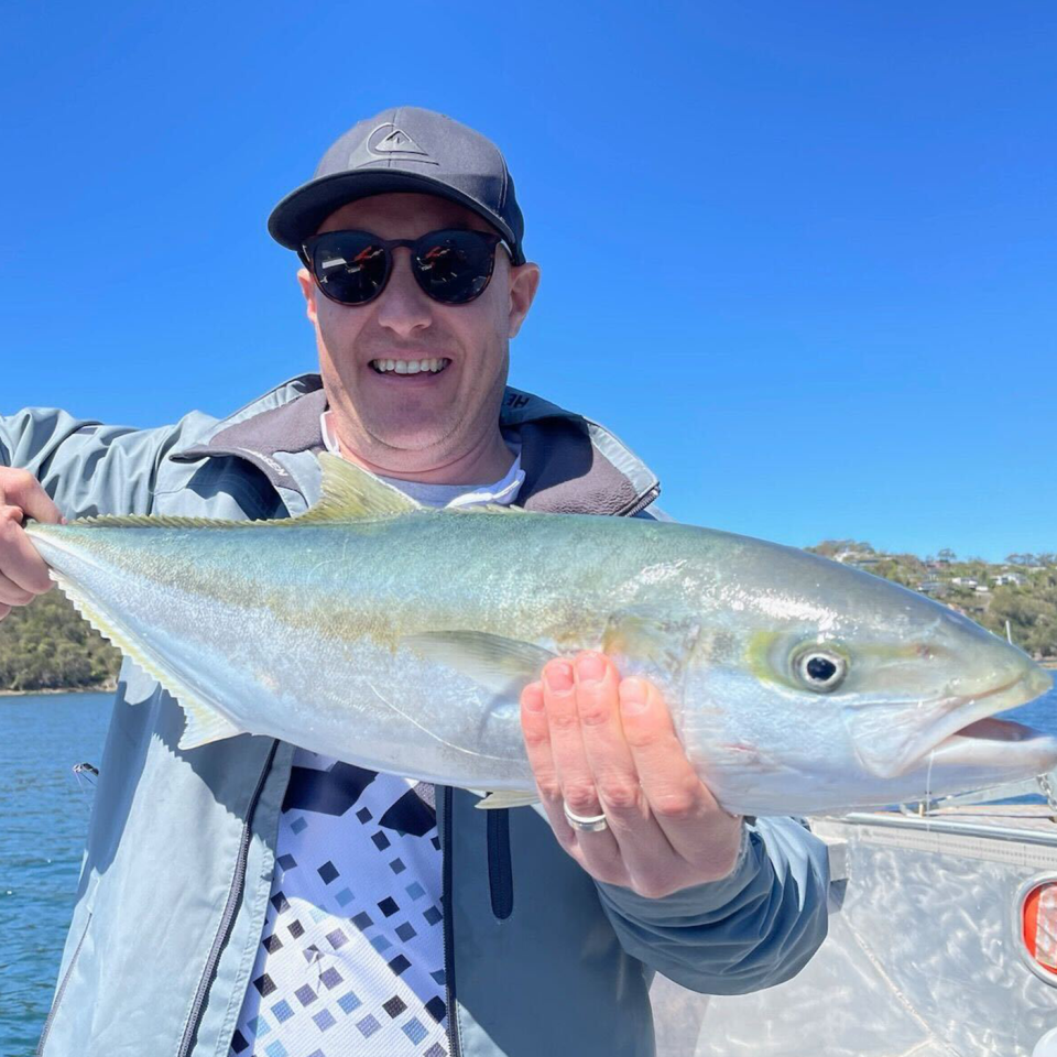 Veteran fisherman Craig McGill holding a fish.