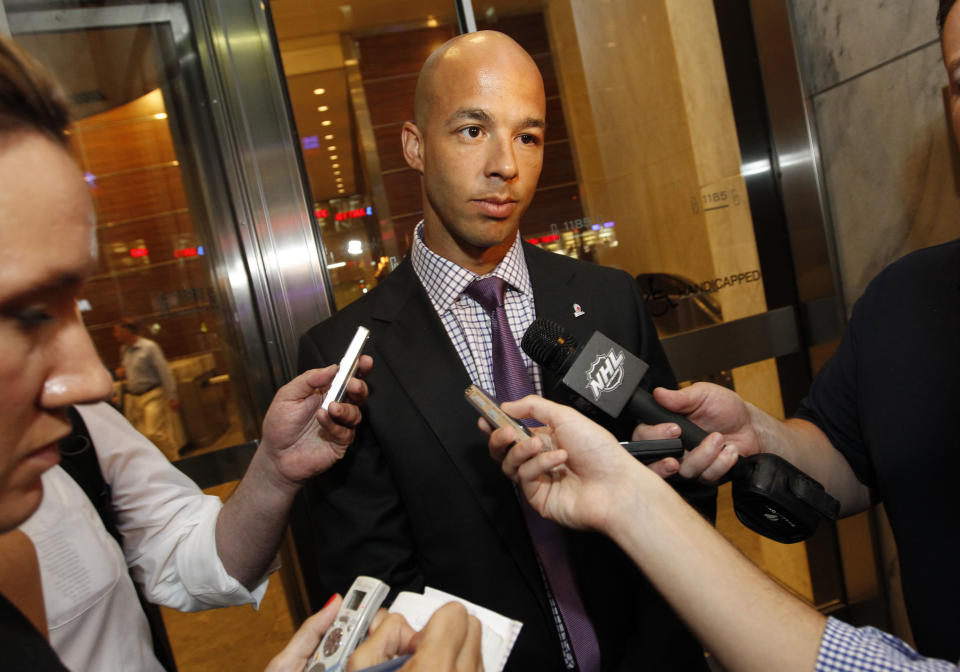 Vancouver Canucks' Manny Malhotra speaks to reporters after a negotiation session between the NHL Players' Association and the NHL, Wednesday, July 18, 2012, in New York. (AP Photo/Jason DeCrow)
