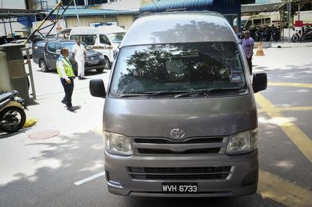 A van believed to be carrying the body of Kim Jong Nam, leaves the Kuala Lumpur Hospital in Kuala Lumpur, Malaysia, in this photo taken by Kyodo March 30, 2017. Mandatory credit Kyodo/via REUTERS