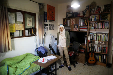 FILE PHOTO: Arab-Israeli poet Dareen Tatour, 35, poses for a picture during an interview with Reuters at her house in Reineh, northern Israel September 26, 2017. REUTERS/Ammar Awad/File Photo