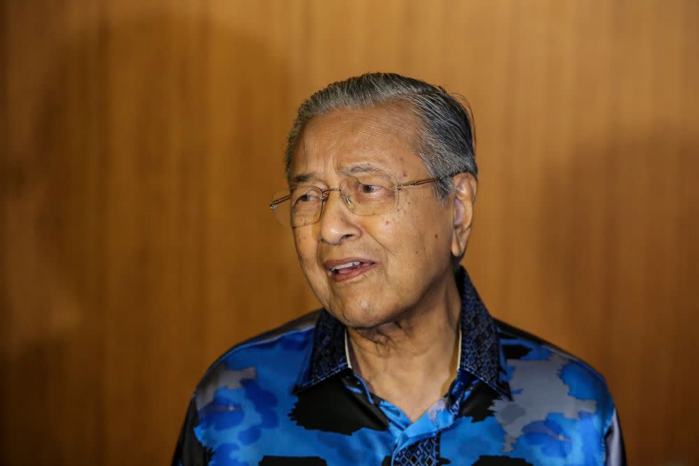 Tun Dr Mahathir Mohamad speaks to reporters during the ‘Malam Sejuta Kenangan’ event at the Setia City Convention Centre in Setia Alam June 12, 2019. — Picture by Hari Anggara