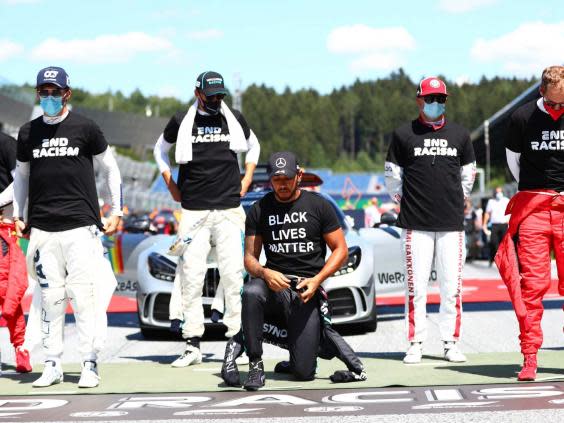 Lewis Hamilton takes a knee before the Austrian Grand Prix (AP)