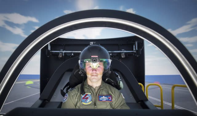 RAF Squadron Leader Andy Edgell, the UK's lead test pilot, uses a specialist fighter jet simulator at BAE Systems in Warton, Lancashire 