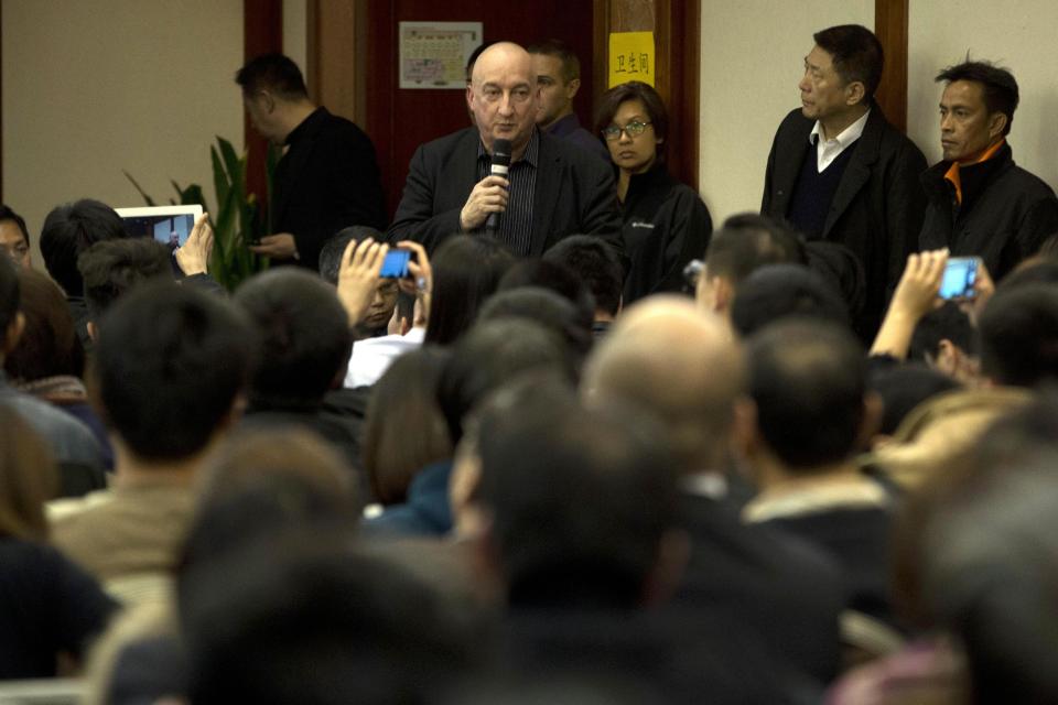 Hugh Dunleavy, commercial director of Malaysia Airlines attends a press conference held for relatives of Chinese passengers aboard missing Malaysia Airlines flight MH370 in a hotel in Beijing, China, Friday, March 14, 2014. The international search for the missing Malaysian jetliner expanded Friday further into the Indian Ocean amid signs the aircraft may have flown on for hours after its last contact with air-traffic control nearly a week ago. (AP Photo/Ng Han Guan)