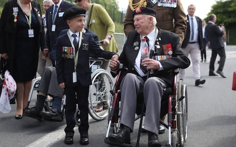 Young George Sayer meets D-Day veteran John Quinn - Credit: Jane Barlow / PA