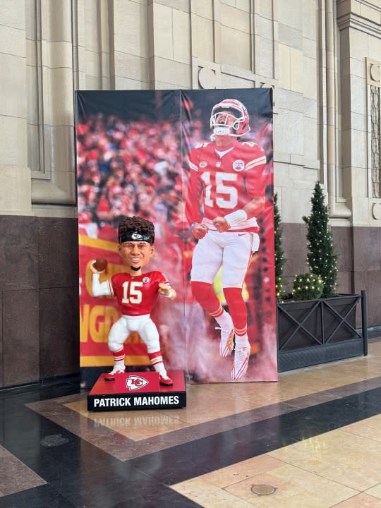 A Patrick Mahomes bobblehead and banner at Union Station before Super Bowl LVIII. (FOX4 photo)