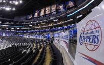 Signs and photos adorn Staples Center before Game 5 of an opening-round NBA basketball playoff series between the Los Angeles Clippers and the Golden State Warriors, Tuesday, April 29, 2014, in Los Angeles. (AP Photo)