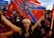 Protestors shout slogans against the change of the country's constitutional name in front of the Parliament building in Skopje, Macedonia June 23, 2018. REUTERS/Ognen Teofilovski