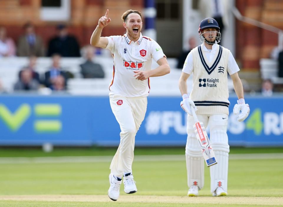 Jamie Porter of Essex celebrates taking the wicket of Max Holden of Middlesex - Alex Davidson/Getty Images