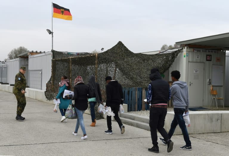 Migrants walk to a registration point for asylum seekers in Erding, Germany in November 2016