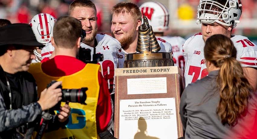 Nov 16, 2019; Lincoln, NE, USA; Wisconsin Badgers players carry the Freedom Trophy after defeating the Nebraska Cornhuskers at Memorial Stadium.