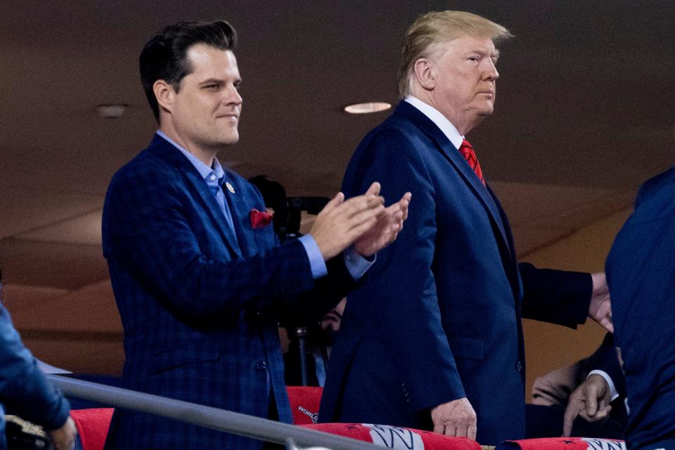 President Donald Trump, right, accompanied by Rep. Matt Gaetz, R-Fla., left, arrive for Game 5 of the World Series baseball game between the Houston Astros and the Washington Nationals at Nationals Park in Washington on Oct. 27, 2019. 