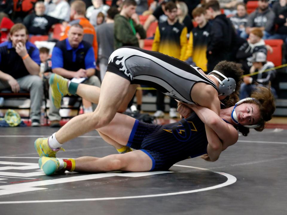 Philo's Talan Bailey throws Bidwell River Valley's Tanner Young, top, during the fifth-place match at 150 pounds during the Division II district tournament on Saturday at Steubenville High School. Bailey won the match by a 20-3 technical fall. 