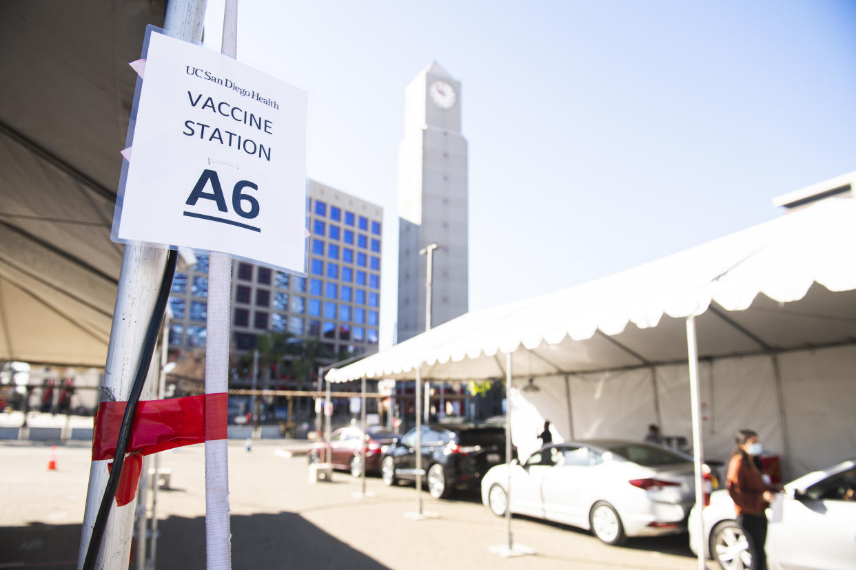 Healthcare workers wait to receive their COVID-19 vaccine in the tailgate lot of PETCO Park. (Photo by Matt Thomas/San Diego Padres/Getty Images)