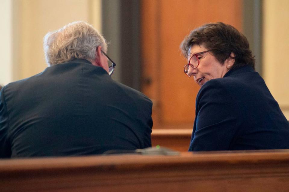 Melanie Smith, a lawyer for the Department of Human Services, talks to Branissa Stroud’s lawyer, Michael Holleman, during a court hearing for Taylor’s case against DHS at Hancock County Chancery Court in Bay St. Louis on Monday, Sept. 12, 2022.