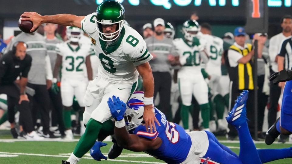 Buffalo Bills defensive end Greg Rousseau (50) pressures New York Jets quarterback Aaron Rodgers (8) during the first quarter at MetLife Stadium.