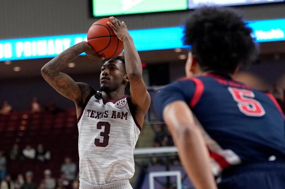 Texas A&M guard Quenton Jackson (3) shoots a three point shot against Mississippi during the second half of an NCAA college basketball game Tuesday, Jan. 11, 2022, in College Station, Texas. (AP Photo/Sam Craft)