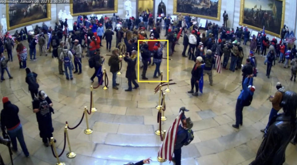 Image 7: Still from CCTV showing Munchel and Eisenhart (yellow square) in the Rotunda (Exhibit 503.2)