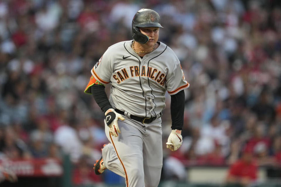 San Francisco Giants left fielder Joc Pederson (23) singles during the third inning of a baseball game against the Los Angeles Angels in Anaheim, Calif., Tuesday, Aug. 8, 2023. Brandon Crawford scored. (AP Photo/Ashley Landis)