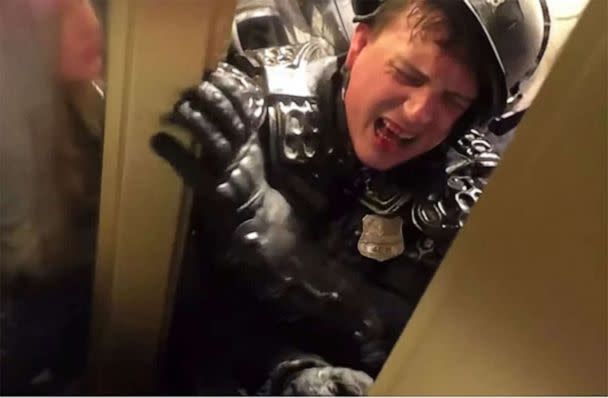PHOTO: Officer Hodges is pictured being crushed in the doorway during the insurrection at the US Capitol, Jan. 6, 2021. (Washington DC Police)