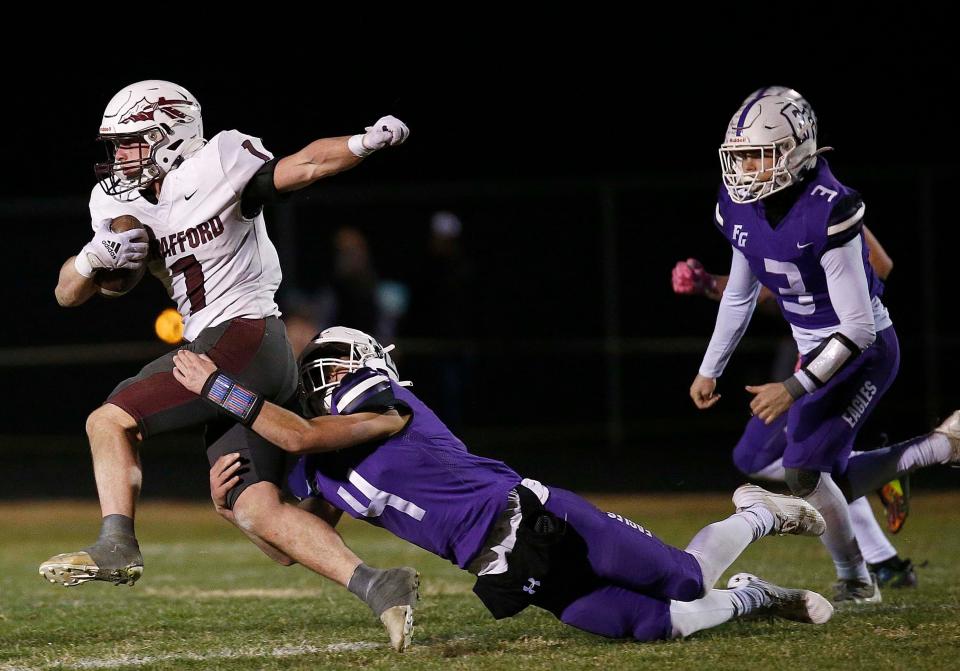 Strafford's Silas Morton breaks a tackle during his team's visit to Fair Grove for District football action on Friday, Nov. 10, 2023.