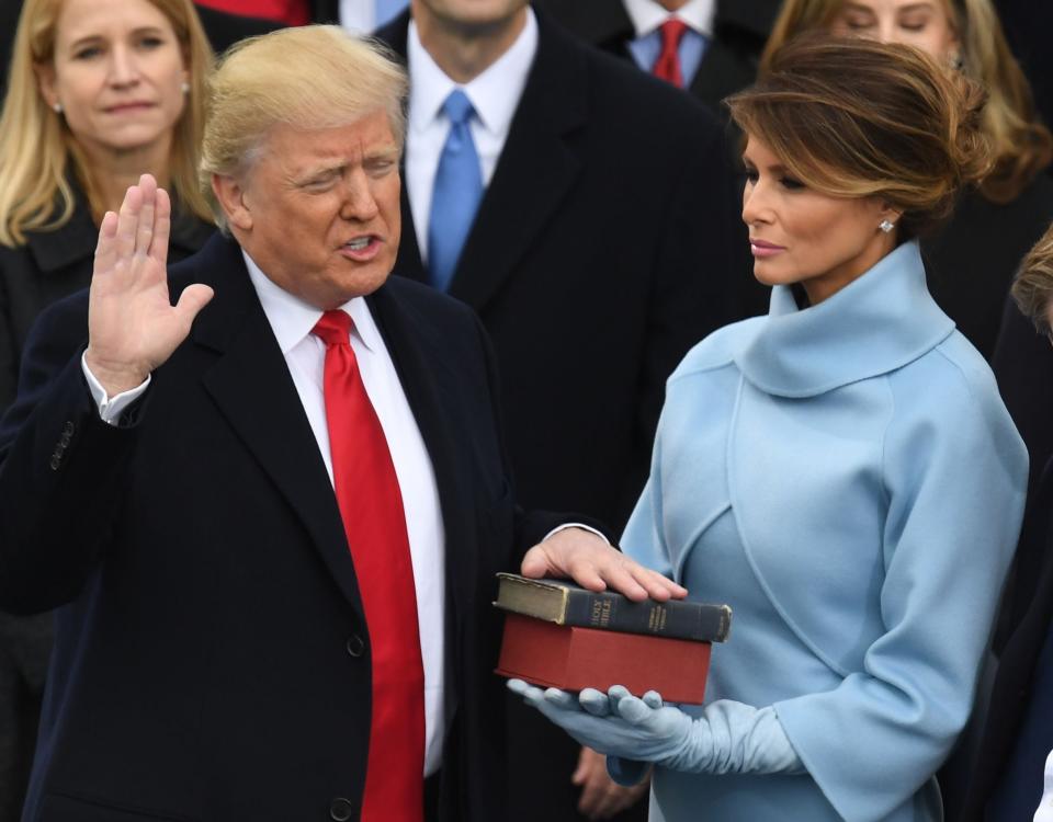 Melania Trump holds the Bible as her husband Donald Trump is sworn in as president on 20 January, 2016  (Photo by Mark RALSTON / AFP) (Photo by MARK RALSTON/AFP via Getty Images)AFP via Getty Images