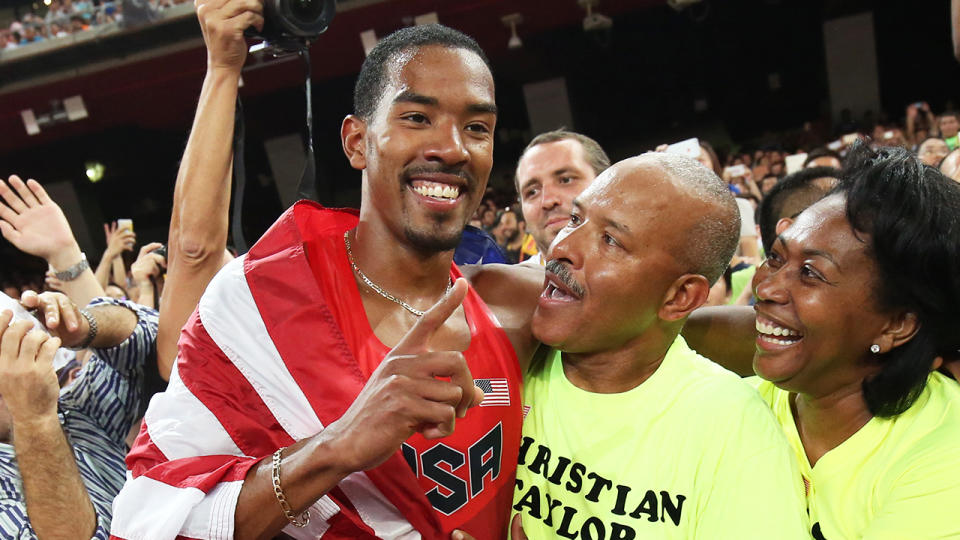 Christian Taylor (pictured left) celebrates gold with his family at the world athletics championships.