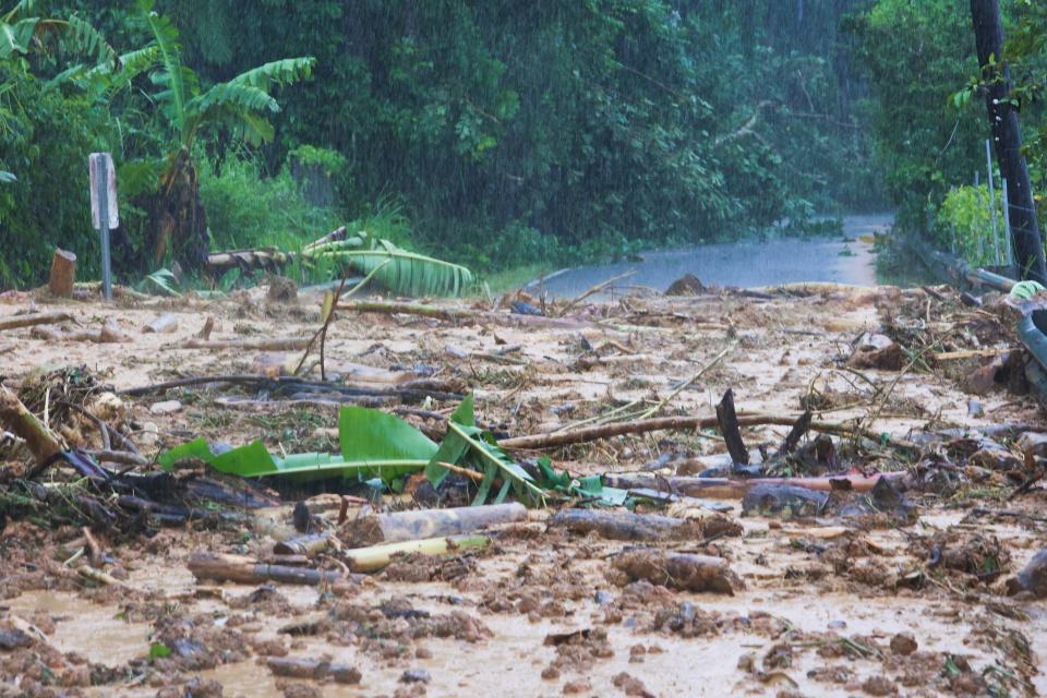 A road is blocked by a mudslide caused by Hurricane Fiona in Cayey, Puerto Rico, Sunday, 18 September 2022 (AP)