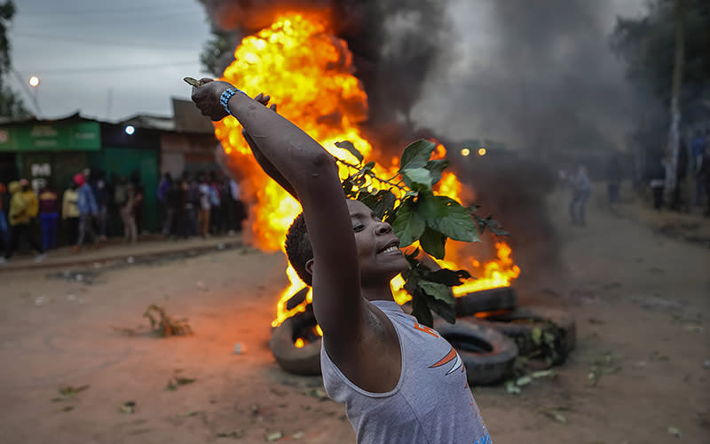 A supporter of Kenyan opposition leader Raila Odinga shouts, “No Raila, No Peace,” in the Kibera neighborhood of Nairobi, Kenya, on Aug. 15. Kenya’s electoral commission chairman has declared Deputy President William Ruto the winner of the close presidential election over five-time contender Raila Odinga, a triumph for the man who shook up politics by appealing to struggling Kenyans on economic terms and not on traditional ethnic ones. <em>Associated Press/Ben Curtis</em>