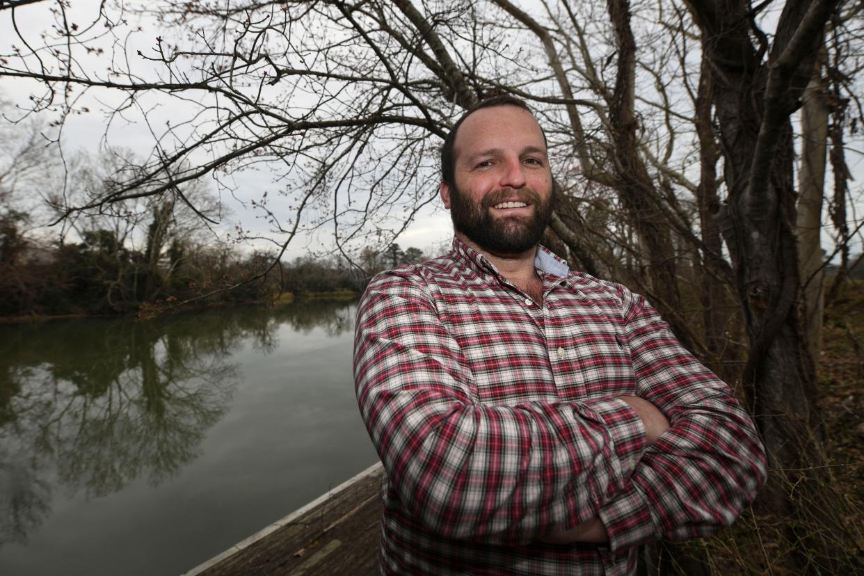 Executive Director of the Augusta Canal Tyler Snead poses for a portrait at the Lake Olmstead Trailhead on Friday, Feb. 9, 2024.