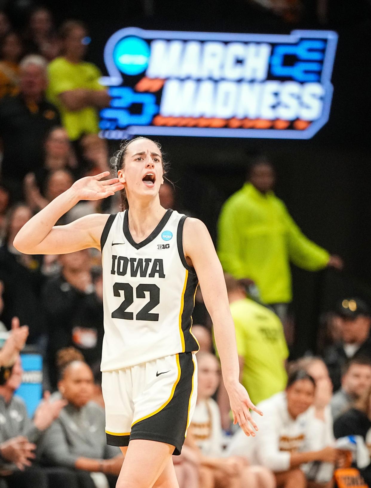 Caitlin Clark celebrates during the final seconds of Iowa's second-round NCAA Tournament win over West Virginia.