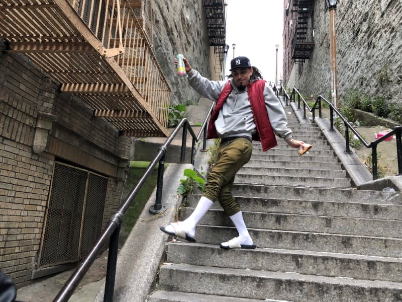Jay Garcia, a radio host from Queens, dances down the "Joker Steps" in the Bronx