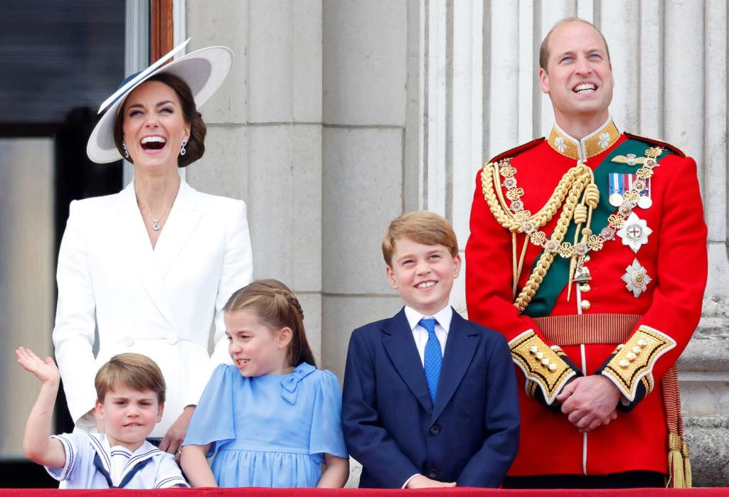 Prince Louis of Cambridge, Catherine, Duchess of Cambridge, Princess Charlotte of Cambridge, Prince George of Cambridge and Prince William, Duke of Cambridge (wearing the uniform of Colonel of the Irish Guards) watch a flypast from the balcony of Buckingham Palace during Trooping the Colour on June 2, 2022 in London, England.
