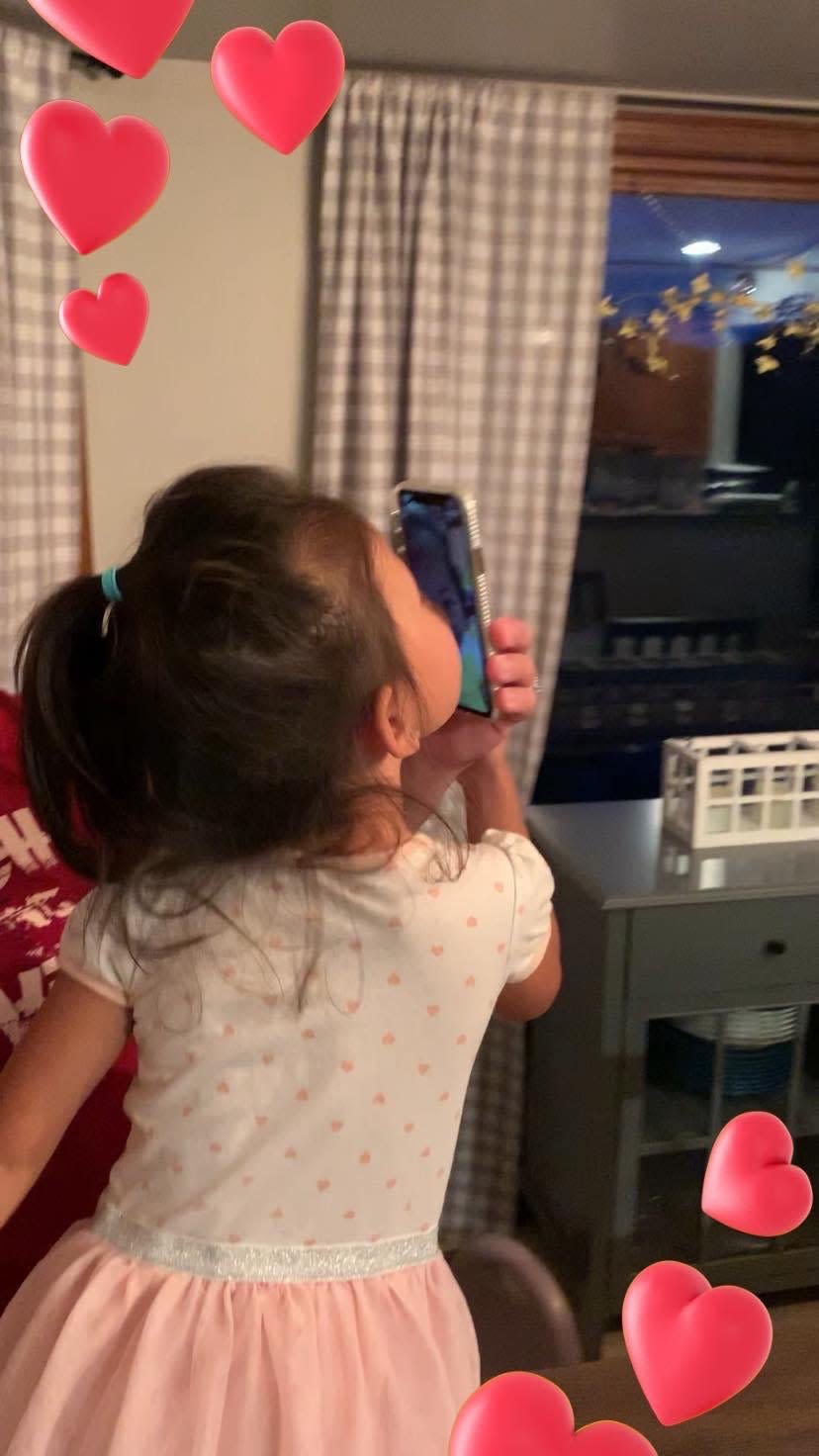 Cora Chandler, who was adopted from China in 2018 when she was 3, sends a kiss to the sister she's eager to meet.