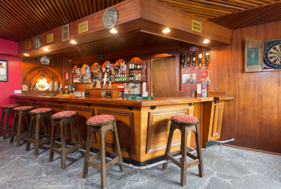 <p>The bar is a perfect place to drink a Guinness (or two) with friends. (Airbnb) </p>