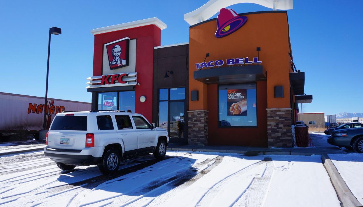 COLORADO, USA - JANUARY 29, 2014: Taco Bell and KFC restaurant on January 29, 2014 in Colorado. Taco Bell has 6,446 restaurants and serves more than 2 billion customers yearly.