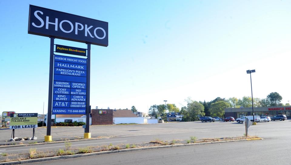 Business signs for the Shopko Plaza in Rothschild are displayed in October 2011. The former Ponderosa Steakhouse building is pictured immediately behind the Shopko Plaza sign. The restaurant building has since been demolished.