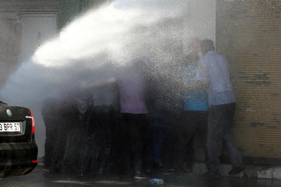Turkish riot police use water cannon to disperse Kurdish demonstrators