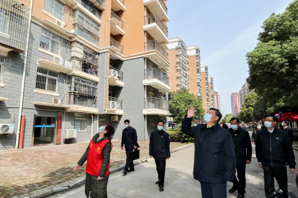 Chinese President Xi Jinping visits a quarantined community in Wuhan in central China's Hubei province on March 10.