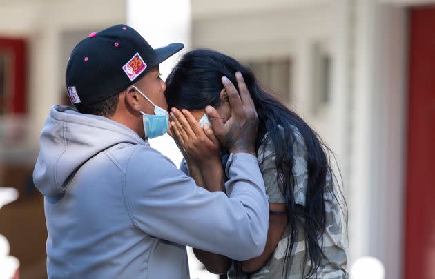 Rafael Eduardo, an undocumented immigrant from Venezuela, hugs another immigrant Thursday outside St. Andrews Episcopal Church on Martha's Vineyard. (Photo: The Washington Post via Getty Images)