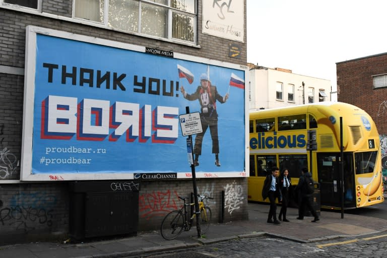 A Brexit-themed billboard depicting Britain's former foreign secretary Boris Johnson waving Russian national flags reading "Thank you Boris"