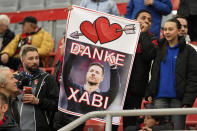 FILE - Supporters hold a banner, reading „Thanks Xabi" prior the German Bundesliga soccer match between Bayer Leverkusen and TSG Hoffenheim at the BayArena in Leverkusen, Germany, on March 30, 2024. Excitement was building in Leverkusen, Germany on Sunday ahead of local team Bayer Leverkusen’s expected Bundesliga title win after an outstanding season so far. (AP Photo/Martin Meissner, File)