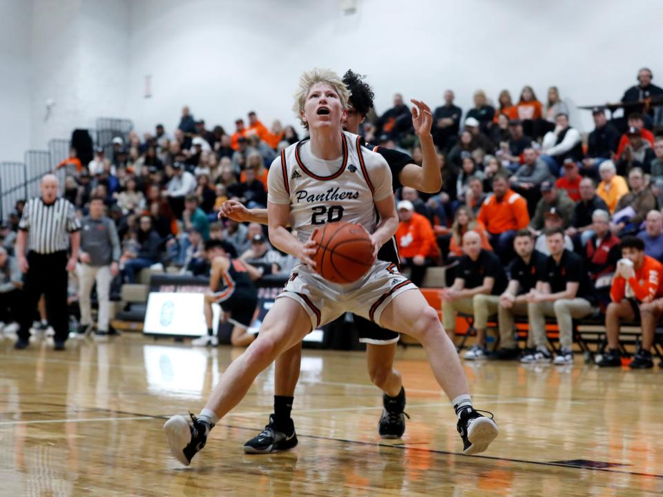 Bentley Hanson readies to shoot during the first half of New Lexington's 49-43 overtime win against visiting Ironton on Saturday night in a Division III sectional final in New Lexngton.