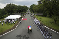 Soldiers carry the flag-draped casket of the late former Philippine President Fidel Ramos during his state funeral at the Heroes' Cemetery in Taguig, Philippines on Tuesday Aug. 9, 2022. Ramos was laid to rest in a state funeral Tuesday, hailed as an ex-general, who backed then helped oust a dictatorship and became a defender of democracy and can-do reformist in his poverty-wracked Asian country. (AP Photo/Aaron Favila)