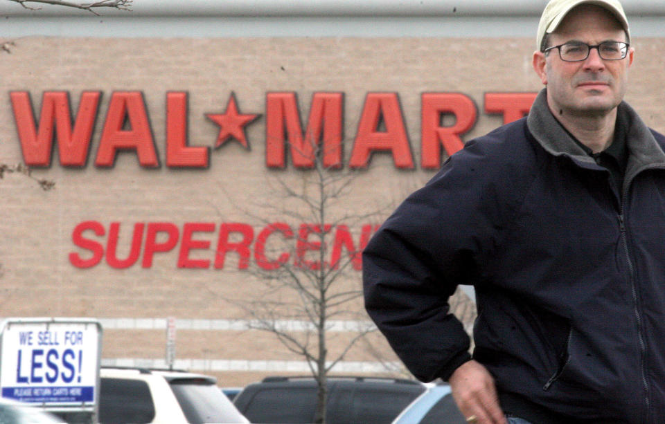 Charles Fishman has just written a book called "The Wal-Mart Effect." For this picture he is standing outside a WAL*MART SUPERCENTER at the Center of Hagerstown, a long strip mall shopping center in Hagerstown, Md.  (Photo by Rich Lipski/The Washington Post/Getty Images)