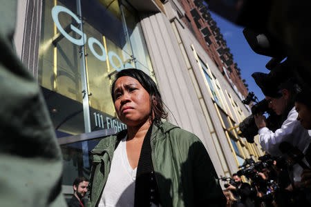 Workers walk outside the Google offices after walking out as part of a global protest over workplace issues in New York, U.S., November 1, 2018. REUTERS/Jeenah Moon