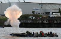 Firefighters set off an explosion as part of a demonstration sea rescue operation.