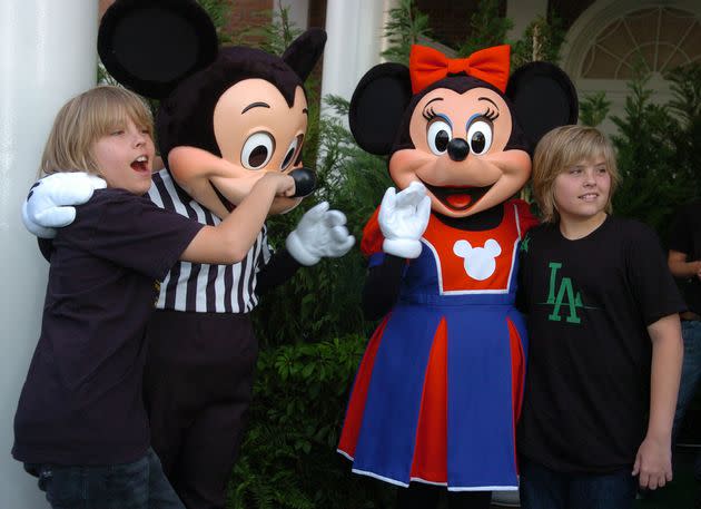 "Suite Life of Zack & Cody" stars Dylan Sprouse, right, and Cole Sprouse, left, pose with Disney characters Mickey and Minnie Mouse before the Disney Channel Games 2007. <span class="copyright">Gerardo Mora via Getty Images</span>