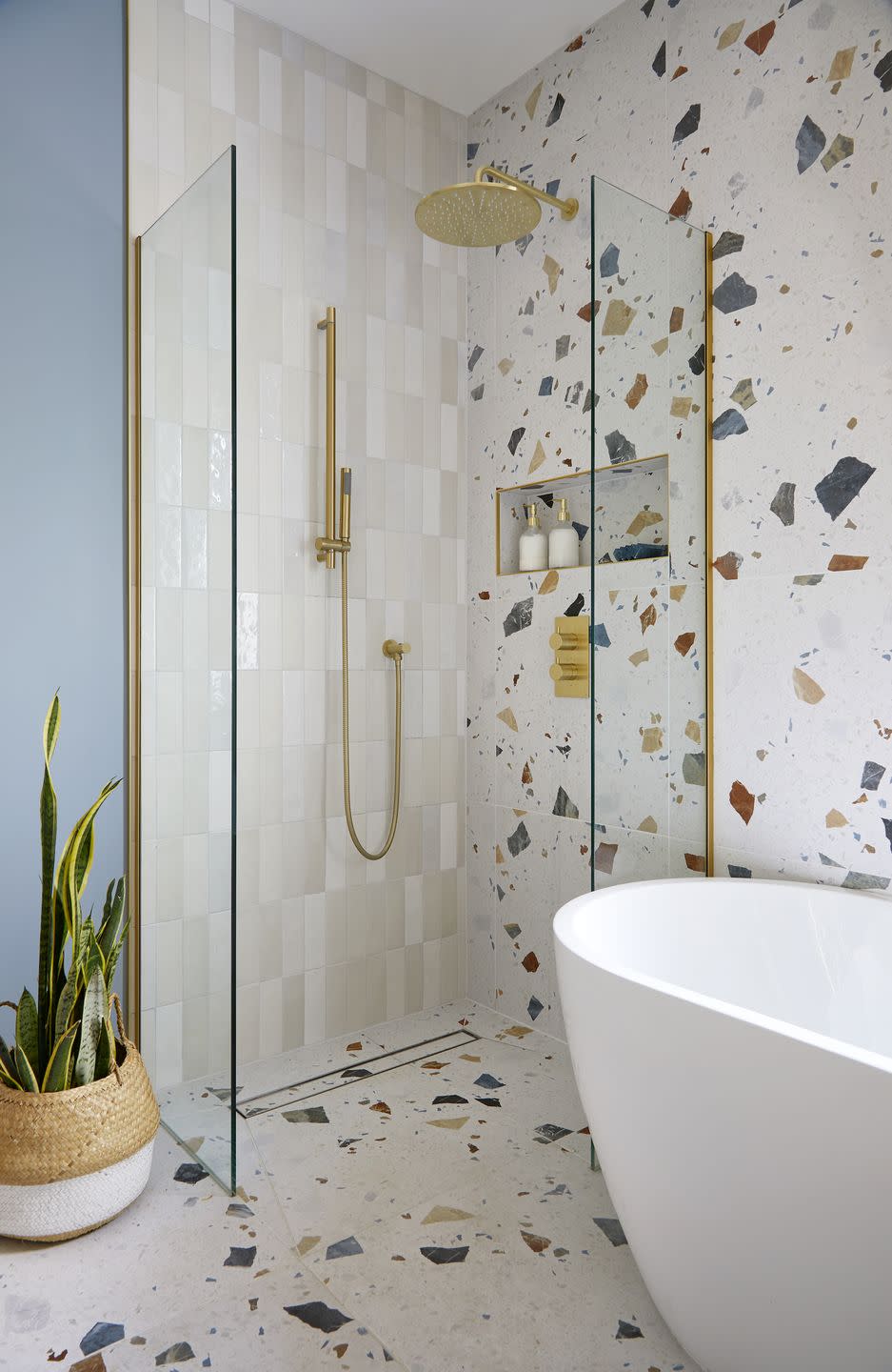 nook shelving in a terrazzo tiled shower